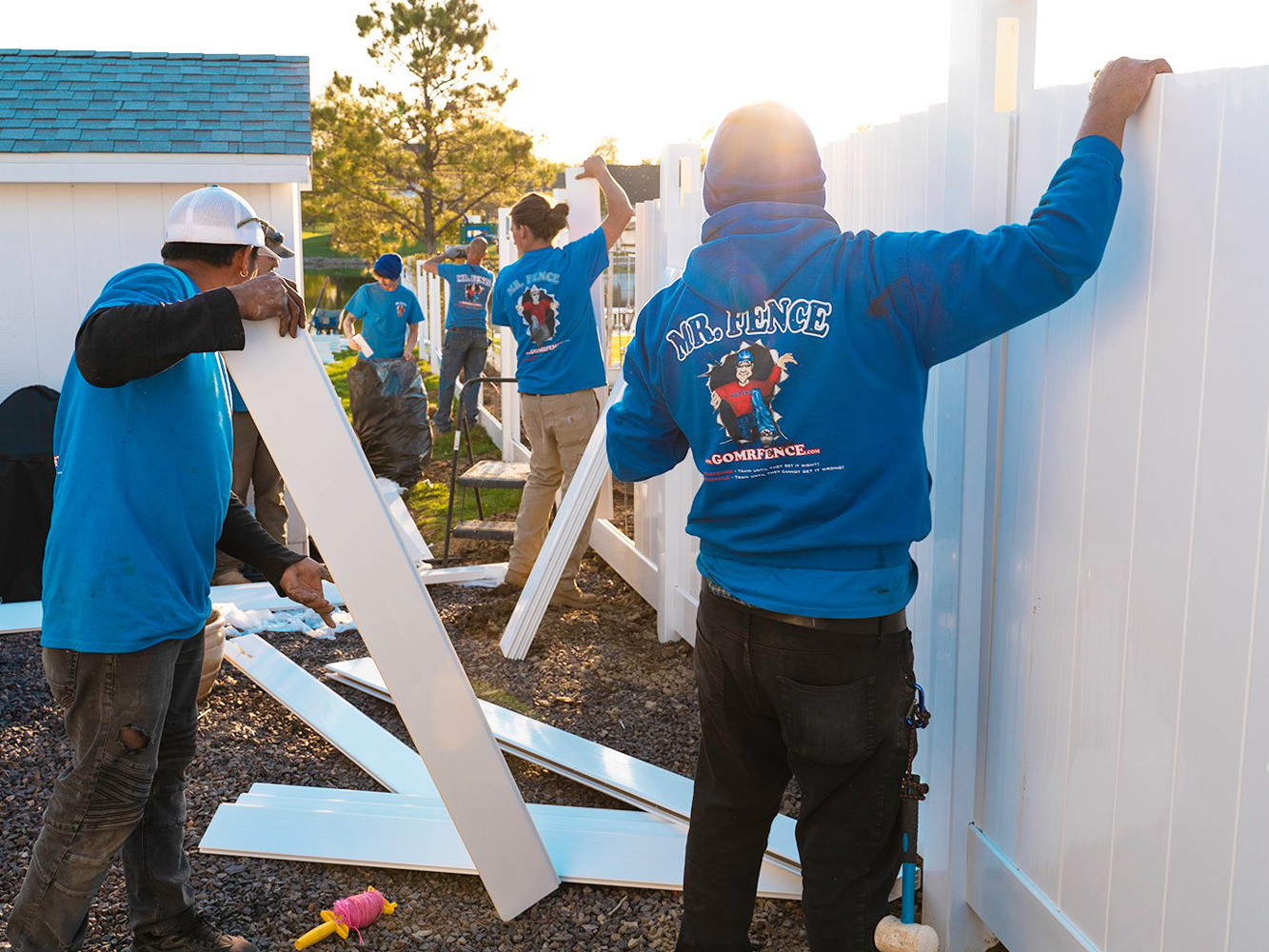 Photo of the Mr. Fence team installing a vinyl fence