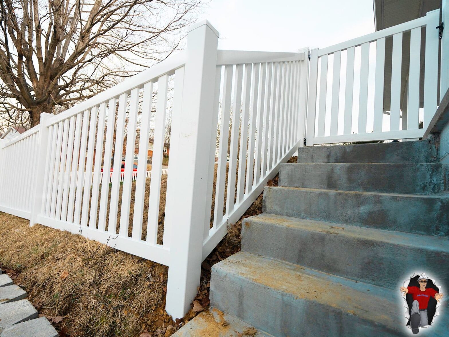 Photo of a vinyl fence in Indiana installed on a sloped property.